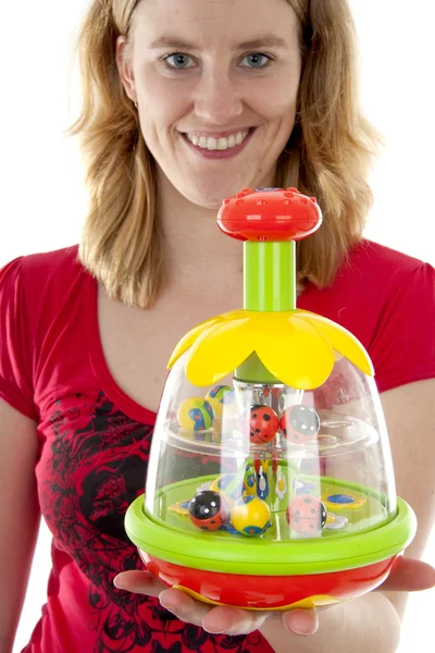 Woman is holding play toy — Stock Photo, Image