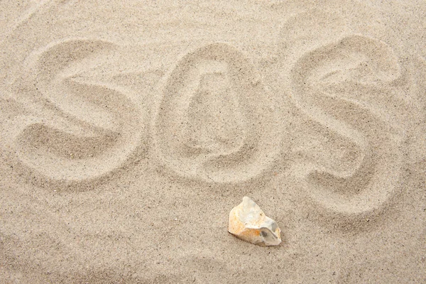 Lettere SOS in sabbia — Foto Stock
