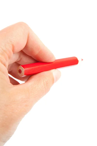 Ruka s červenou tužkou — Stock fotografie