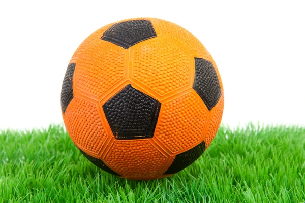 Orange soccer ball on grass — Stock Photo, Image