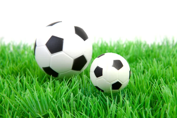Dos pelotas de fútbol sobre hierba — Foto de Stock