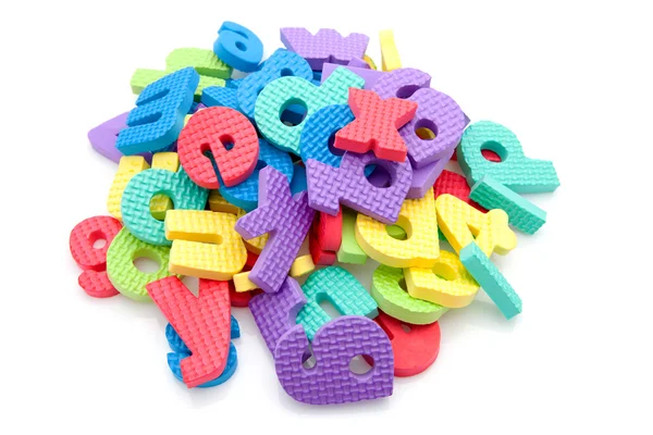 Pilha de letras de espuma coloridas — Fotografia de Stock
