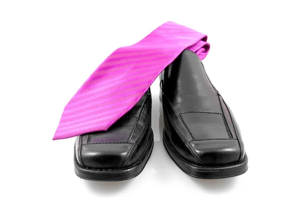 Pair of black male business shoes and pink tie — Stock Photo, Image