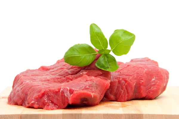 Raw steak meat on cutting board — Stock Photo, Image