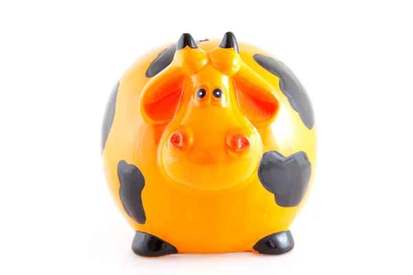 Piggy bank in de vorm van Oranje koe — Stockfoto