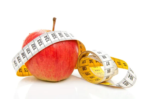 Apple with measure tape for diet — Stock Photo, Image
