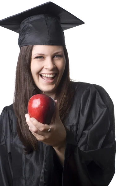 Graduate holding apple — Stock Photo, Image