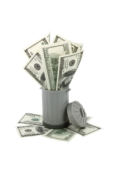 Trash can overfilled with american money — Stockfoto