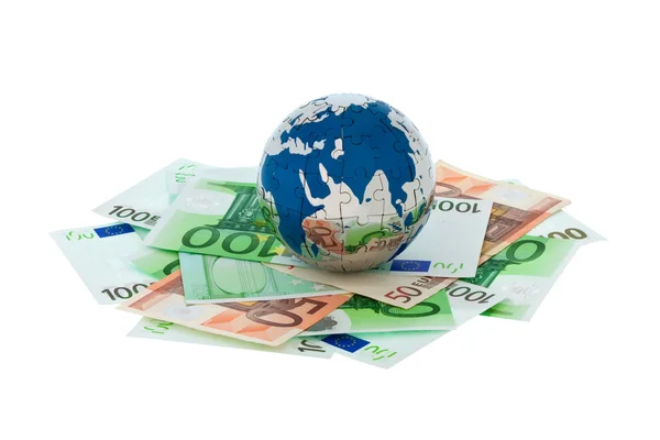 Pénz és a globe — Stock Fotó