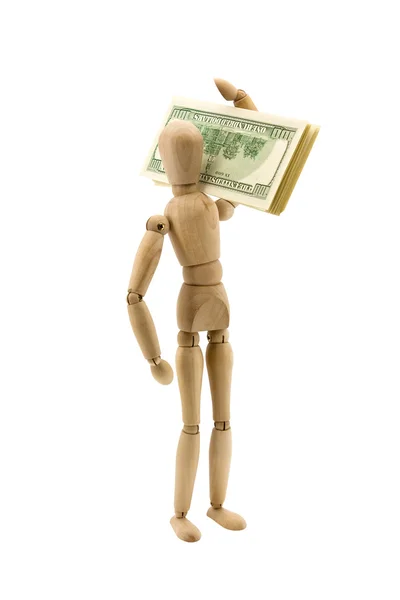 Figura de madeira move os dólares — Fotografia de Stock