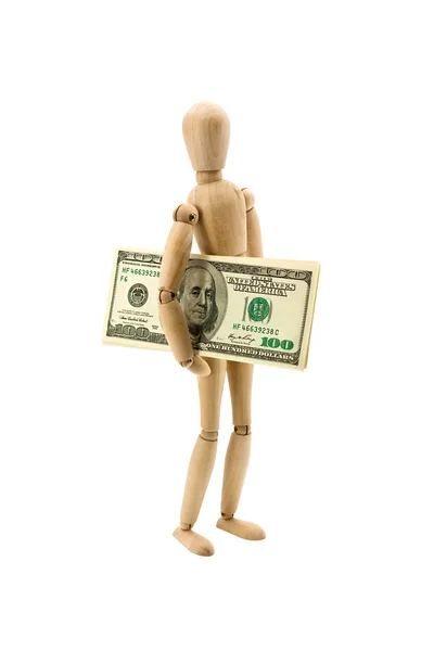 Деревянная фигура двигает доллары — стоковое фото