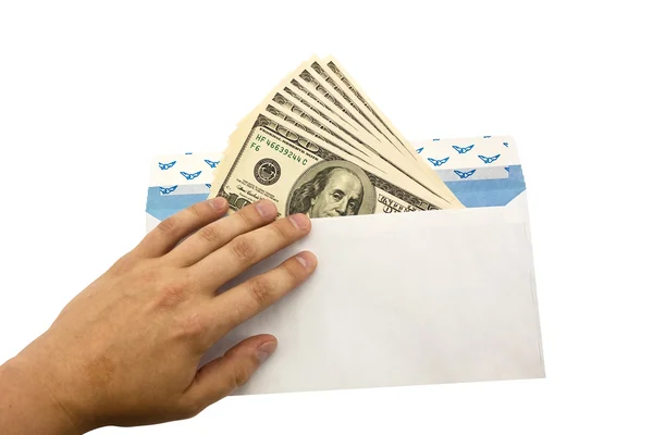 Рука и деньги в конверте — стоковое фото