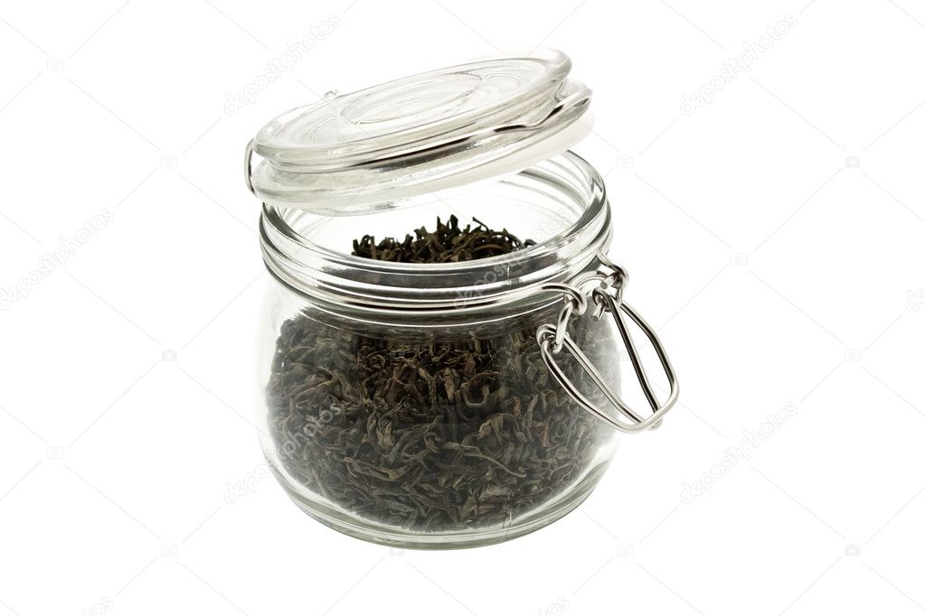 Green tea in glass jar isolated on white