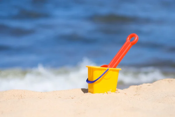 Childs beach bucket and shovel on seacoast — Stock Photo © inarik #3315780