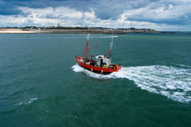 Fishing boat on stormy weather clipart