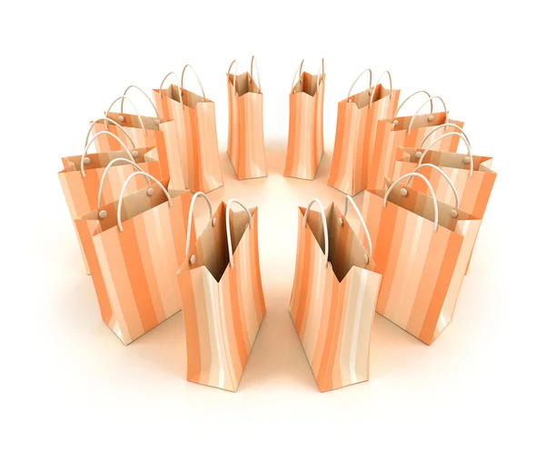 Circle of salmon colored shopping bags — Stock Photo, Image