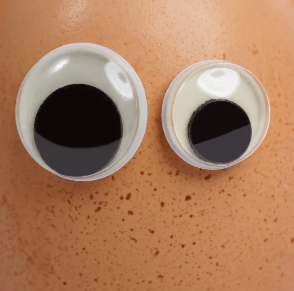 Doll eyes on an egg shell — Stock Photo, Image