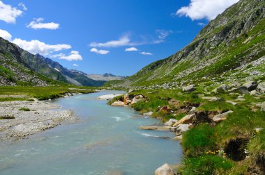 River flowing in glacial valley clipart