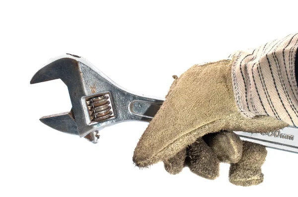 Smutsiga läderhandskar och monkey wrench — Stockfoto