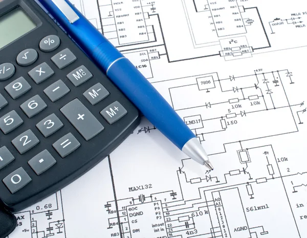 Calculator and pen on electrical diagram — Stock Photo, Image