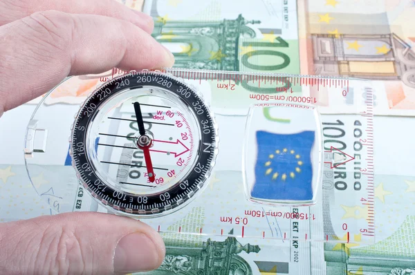 Währung und Kompass — Stockfoto