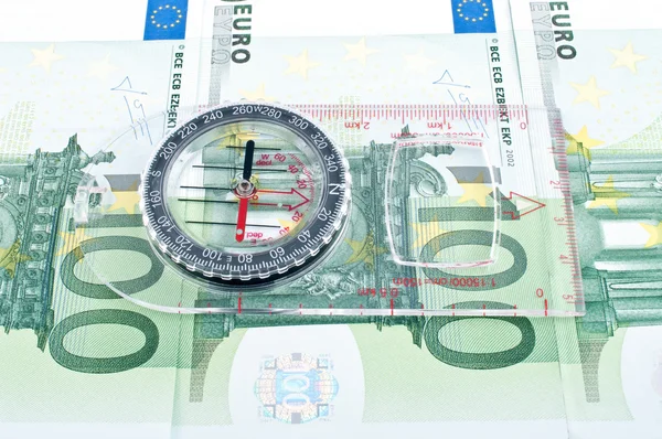 Currency and compass — Stock Photo, Image