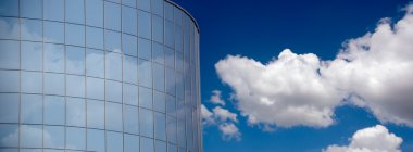 Corporate building and clouds