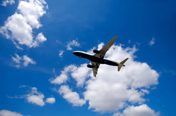 Plane and clouds — Stock Photo, Image