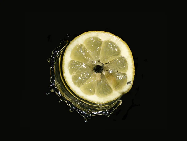 stock image Lemon slice in water splashes