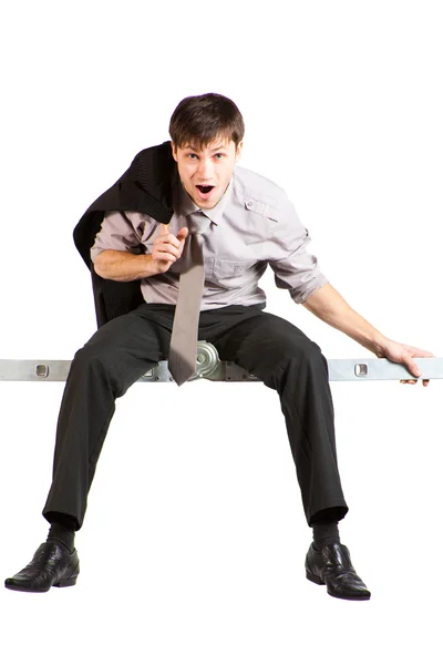 Affärsman som sitter på stege — Stockfoto