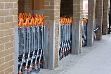 A row of shopping trolleys clipart