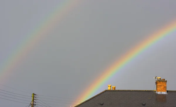 stock image Beautiful rainbow over the rooftops