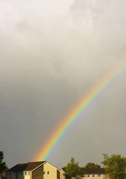 Stock image Beautiful rainbow over the rooftops