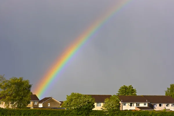 stock image Beautiful rainbow over the rooftops