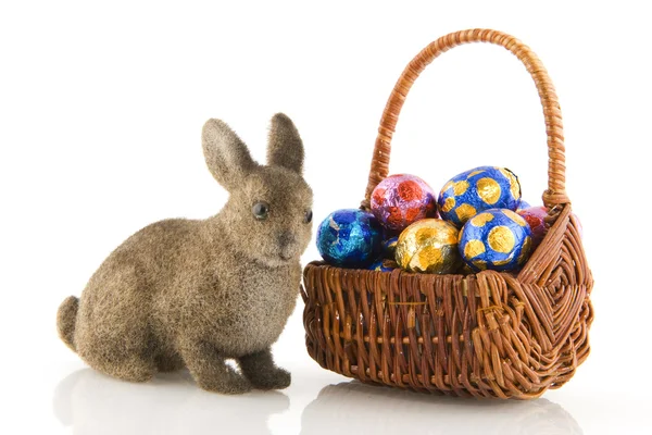 Easter bunny with chocolate eggs — Stock Photo, Image