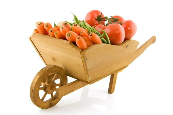 Wheelbarrow with vegetables — Stock Photo, Image