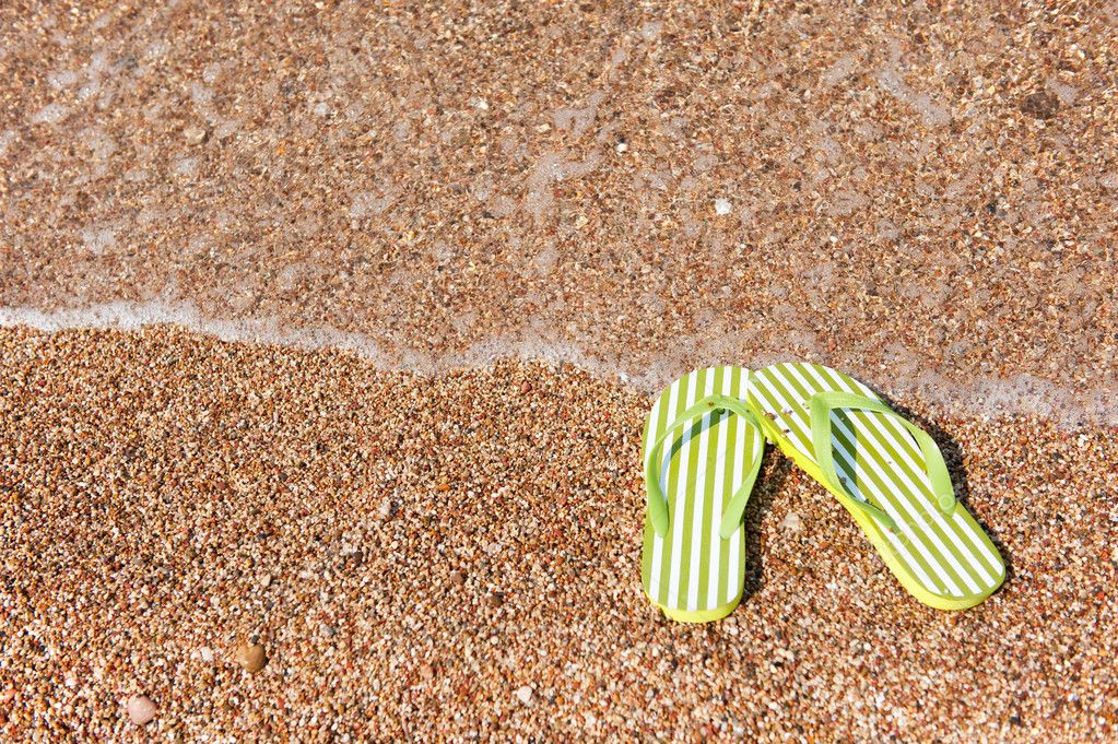 Flip flops on the beach Stock Photo by ©ivonnewierink 2783476