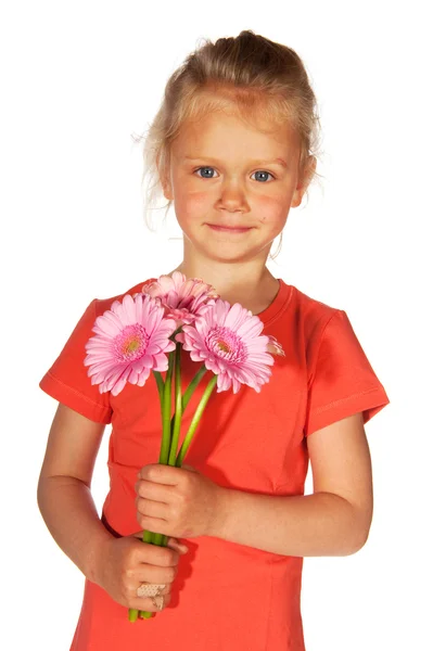 Hermosa chica rubia con flores — Foto de Stock