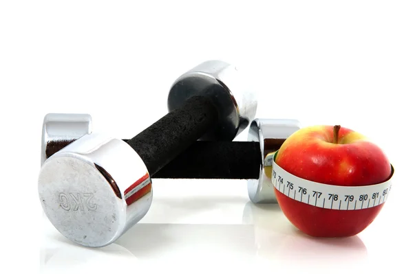 Apple and dumbels — Stock Photo, Image