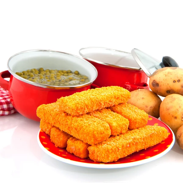 Red pans with vegetables — Stock Photo, Image