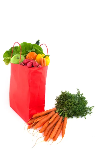 Oranje papieren zak met gezond voedsel — Stockfoto