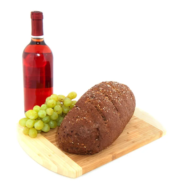 Celozrnný chléb hrozny a víno — Stock fotografie