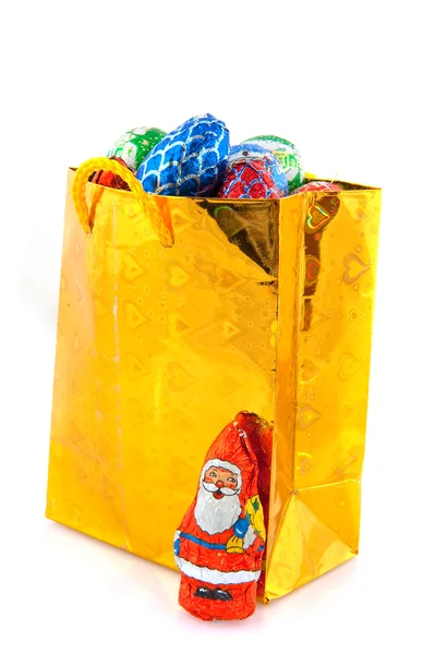 Bolso de oro con dulces de Navidad — Foto de Stock