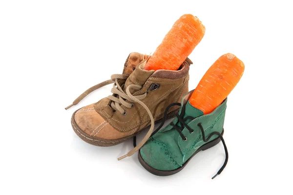 Shoes with carrots — Stock Photo, Image
