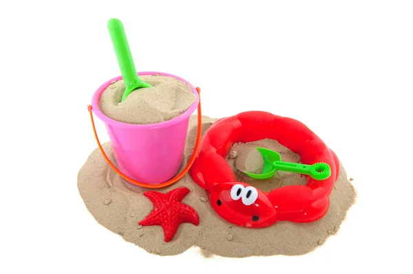 Speelgoed in het zand — Stockfoto