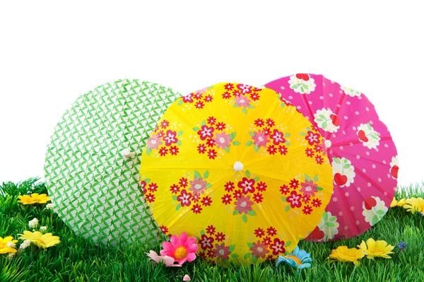 Colorful parasols in the grass — Stock Photo, Image