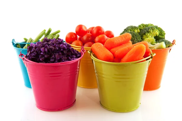 Fresh vegetables in colorful buckets — Stock Photo, Image