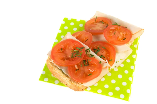 Bread roll with chicken and tomatoes — Stock Photo, Image