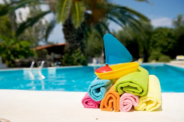 Rolled towels and toys — Stock Photo, Image