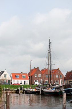 Typical boats in Dutch village clipart